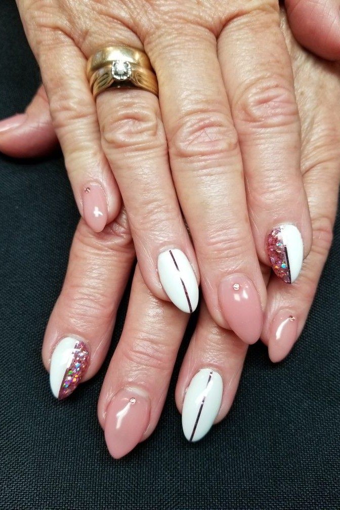 Pink and white with thin black line and red glitter accent - nail art for women over 50
