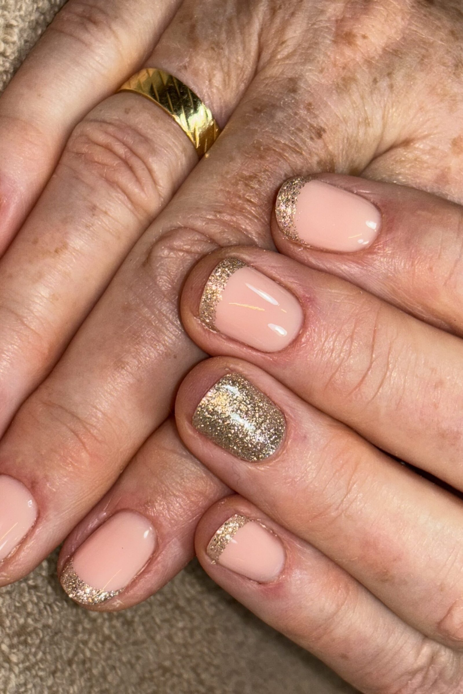 Pink with gold glitter accent nails, mature hands - nail art for women over 50