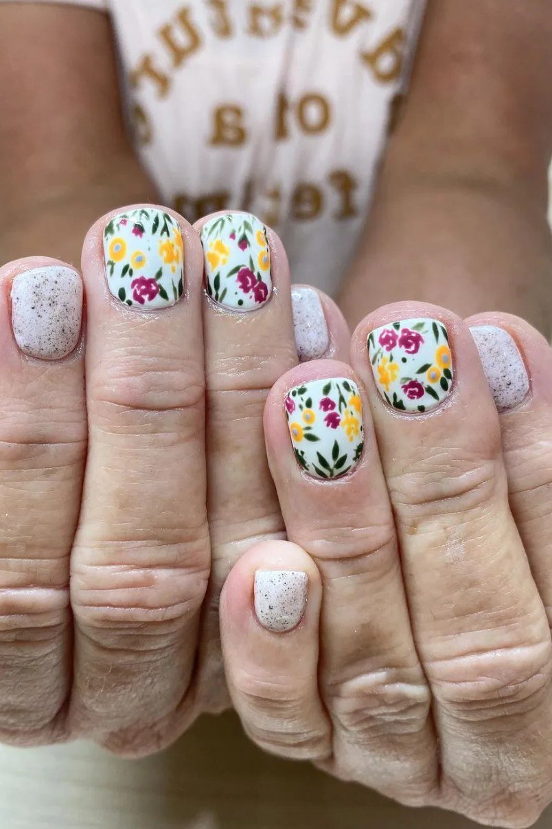 Grey with bright floral art, old hands - nail art for women over 50