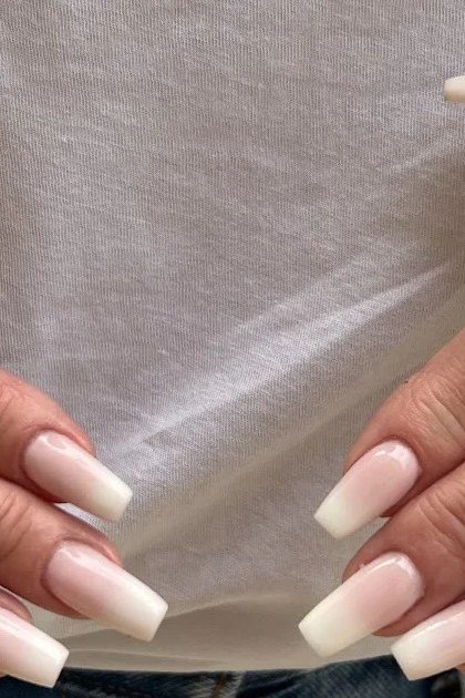Crisp white french on long squoval nails, two hands