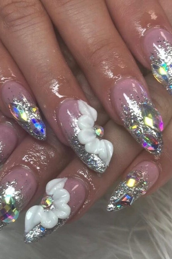 Holographic glitter stiletto nails with 3D white floral art