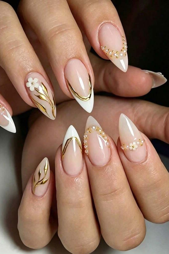 Nude almond nails with gold tips and gold marble art