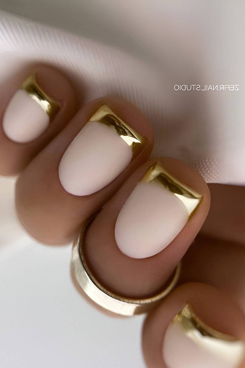 White nails with gold french tips, short square
