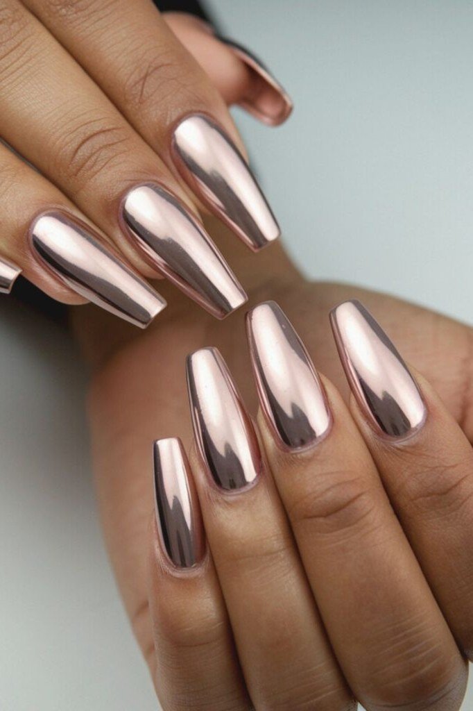 Rose-gold chrome long almond nails