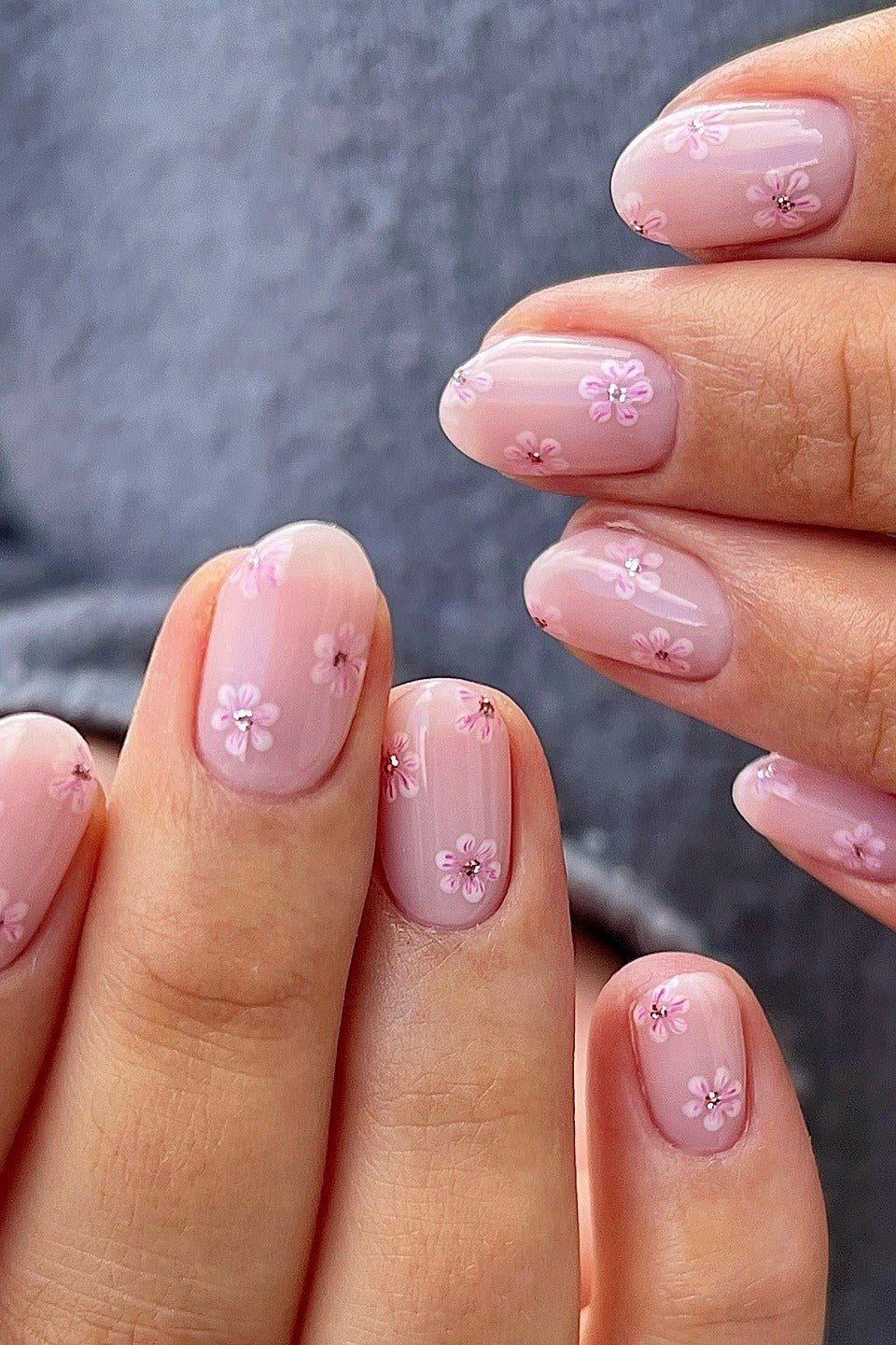 Pink oval nails with cherry blossom art