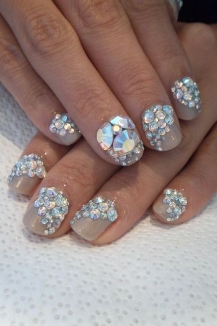 Nude nails with rhinestone-encrusted tips