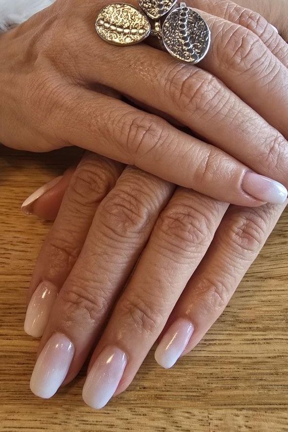 Long nude almond nails, glossy, statement rings