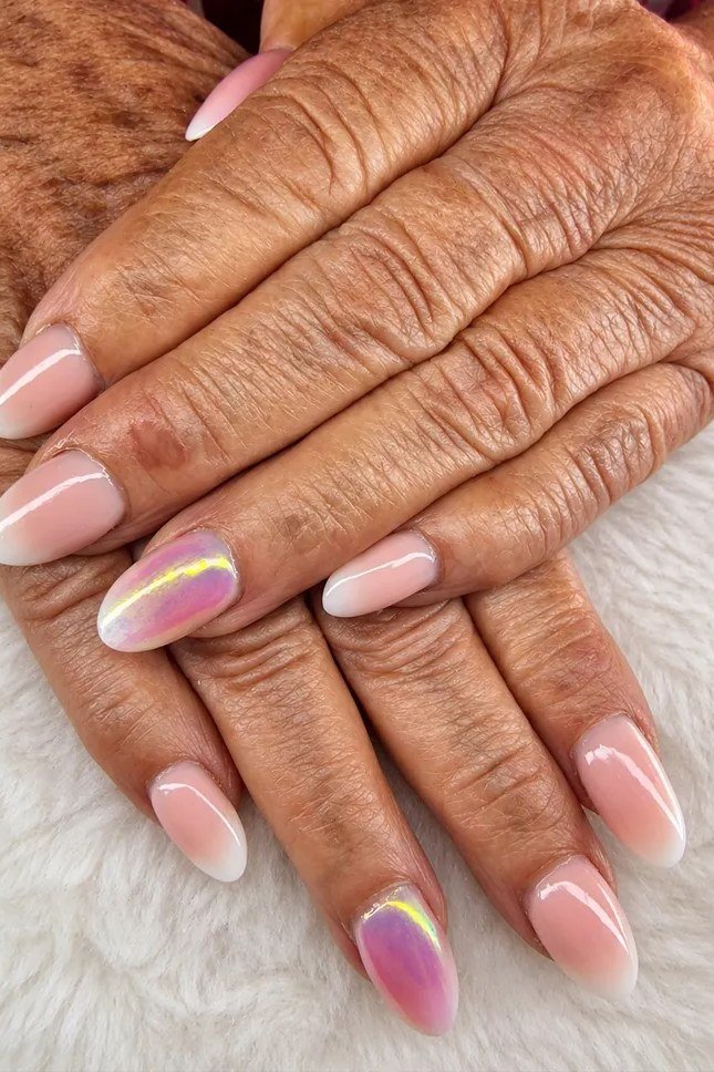 Pink French ombre with an iridescent accent nail for older women