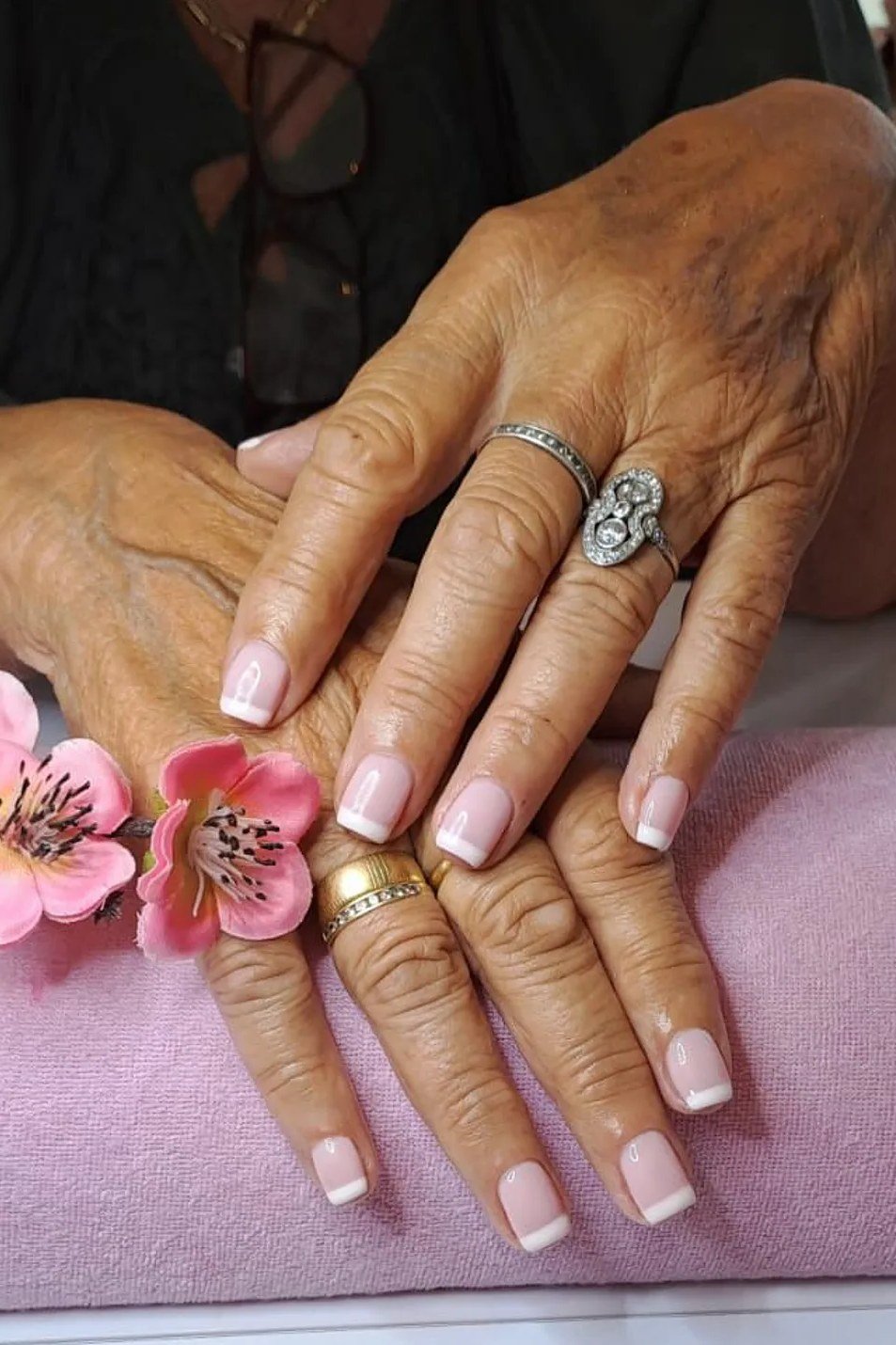 French manicure with cherry blossom accents for women over 50