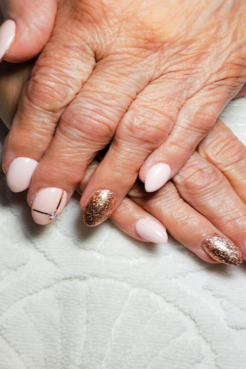 French manicure with gold accents for women over 70