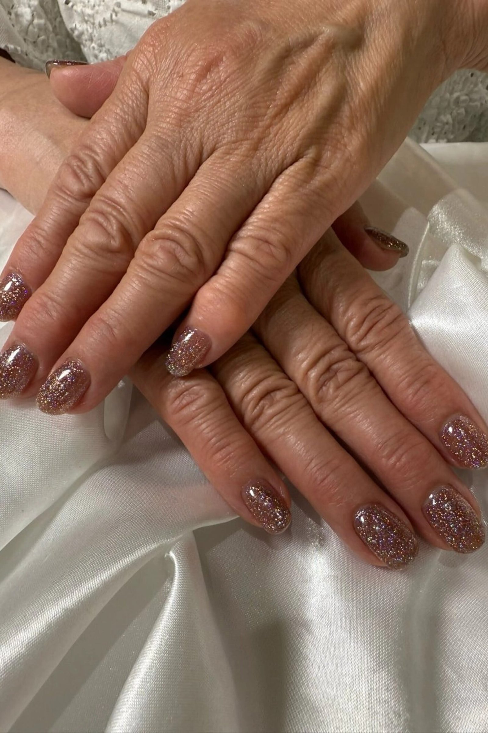 Elegant taupe nails for women over 70 on older hands