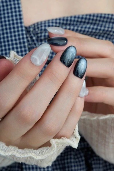 Blue-gray jelly nails on hand with denim cuff - jelly nail idea for women over 60