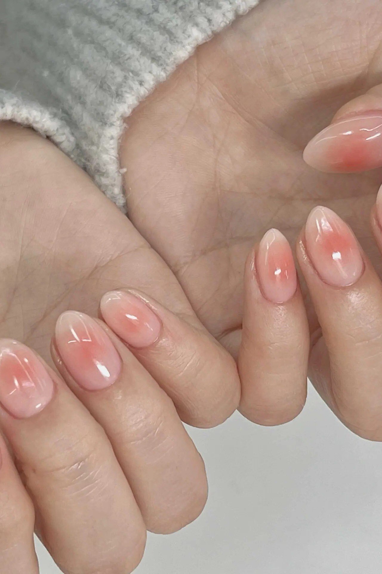 Coral pink jelly nails, short oval, on both hands - jelly nail idea for women over 60