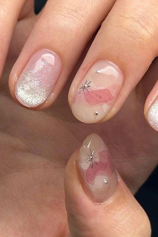 Sheer white-pink jelly nails with tiny floral nail art - jelly nail idea for women over 60