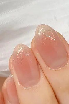 Nude pink sheer jelly nails close-up, glossy - jelly nail idea for women over 60