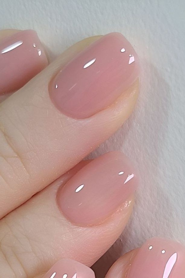 Nude pink jelly nails close-up, glossy squishy - jelly nail idea for women over 60