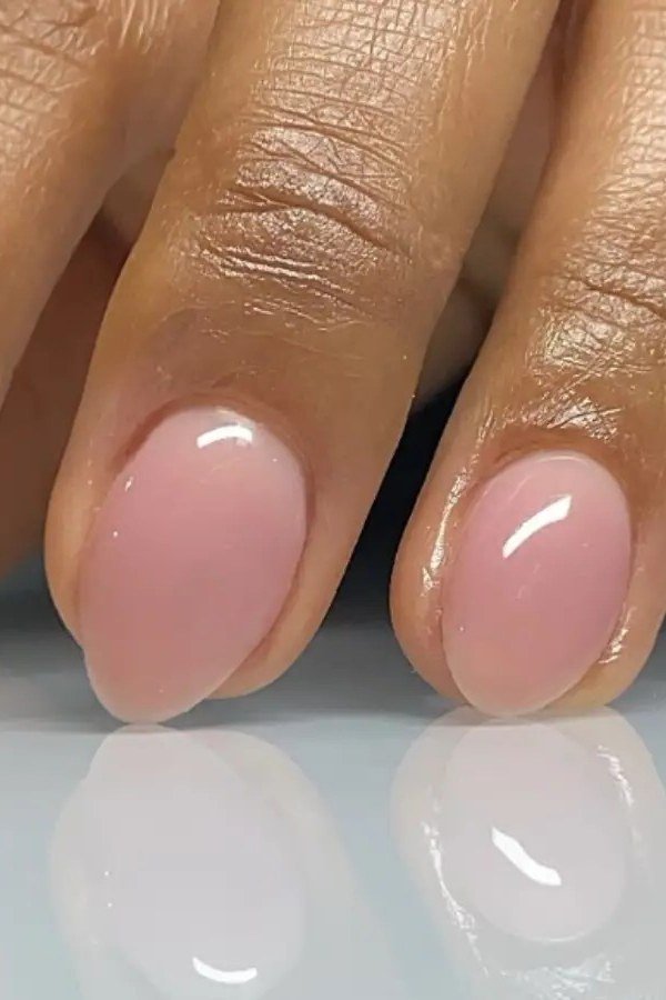 Nude jelly nails on dark skin hands, almond - jelly nail idea for women over 60