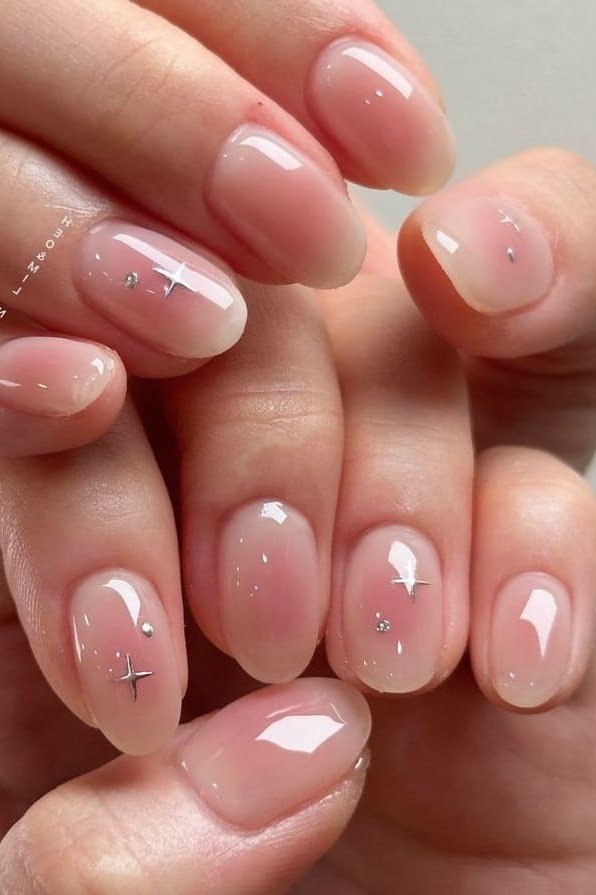 Nude jelly nails with tiny star nail art, short - jelly nail idea for women over 60