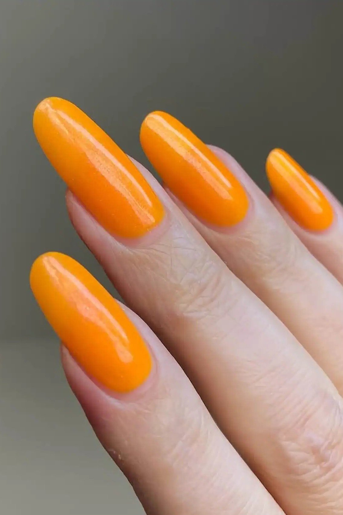 Bright orange jelly nails, almond - jelly nail idea for women over 60