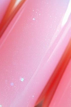 Pink shimmer jelly nails close-up, glittery translucent - jelly nail idea for women over 60
