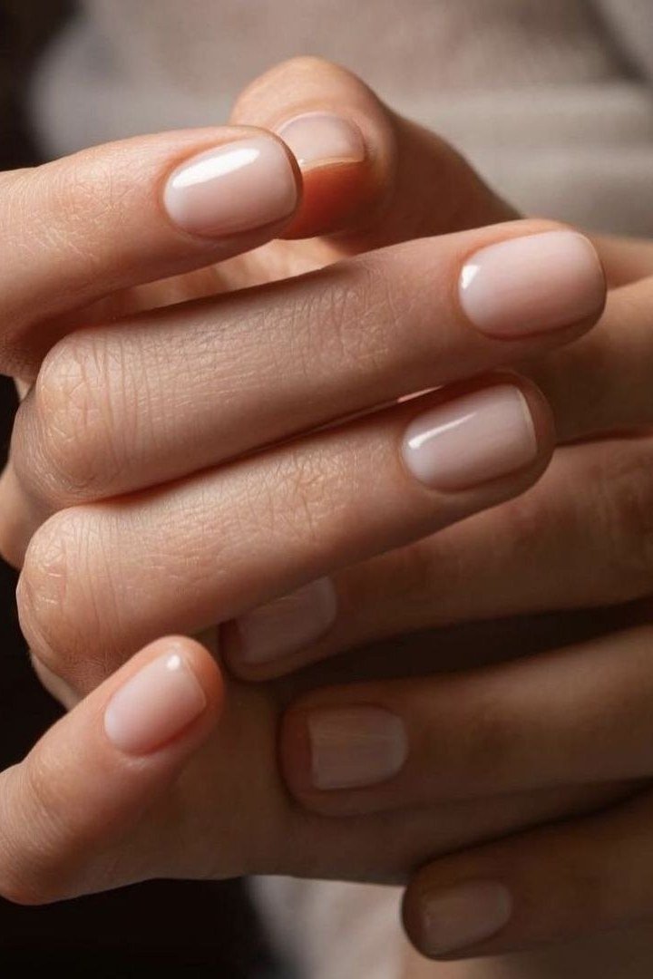Clasped hands, sheer nude gloss for women over 60 - simple clear nail idea 6