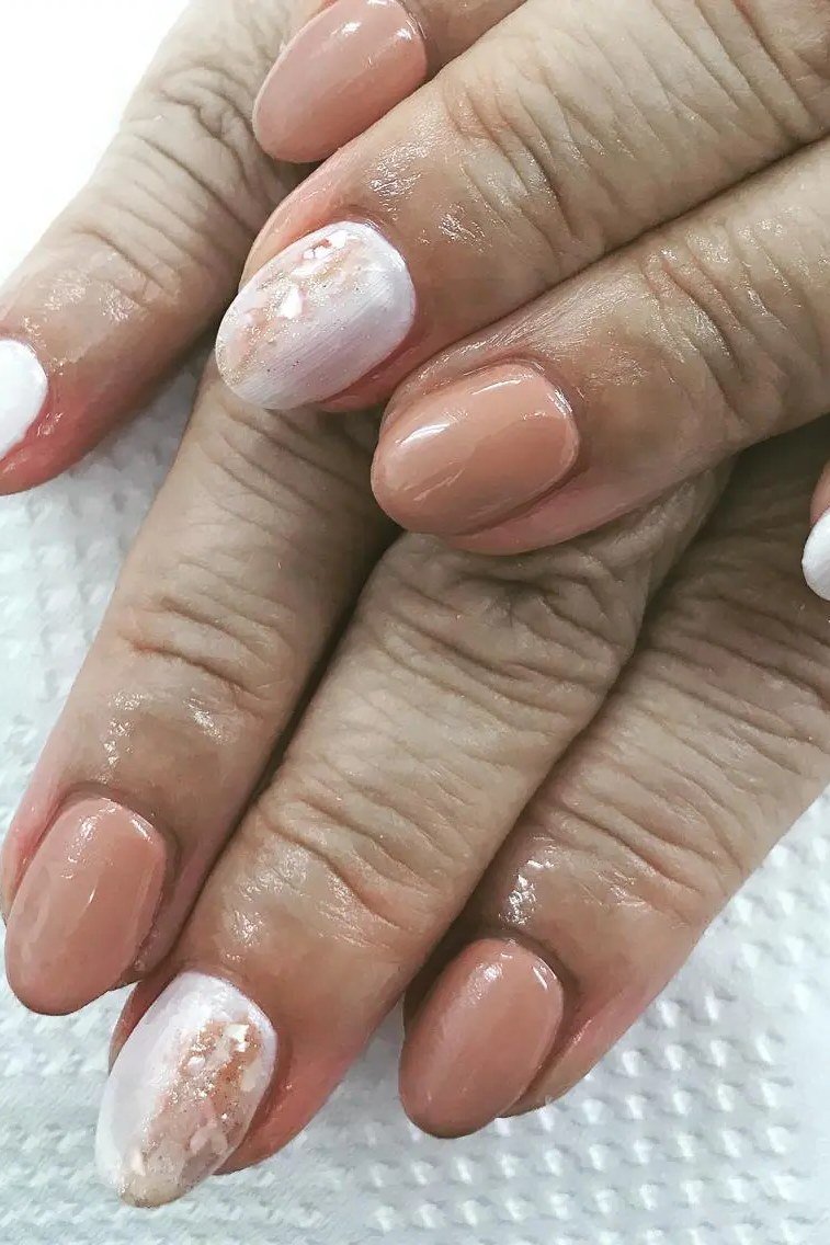 Nude Nails with White Marble Accents - marble nail design for women over 60