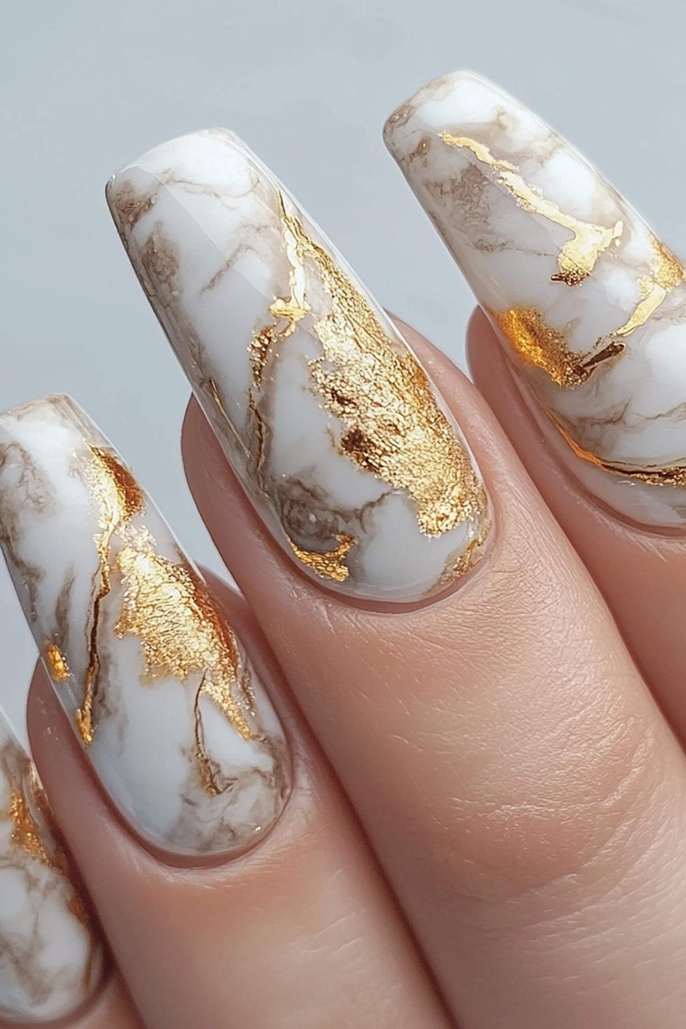 White Marble with Gold Veins - marble nail design for women over 60