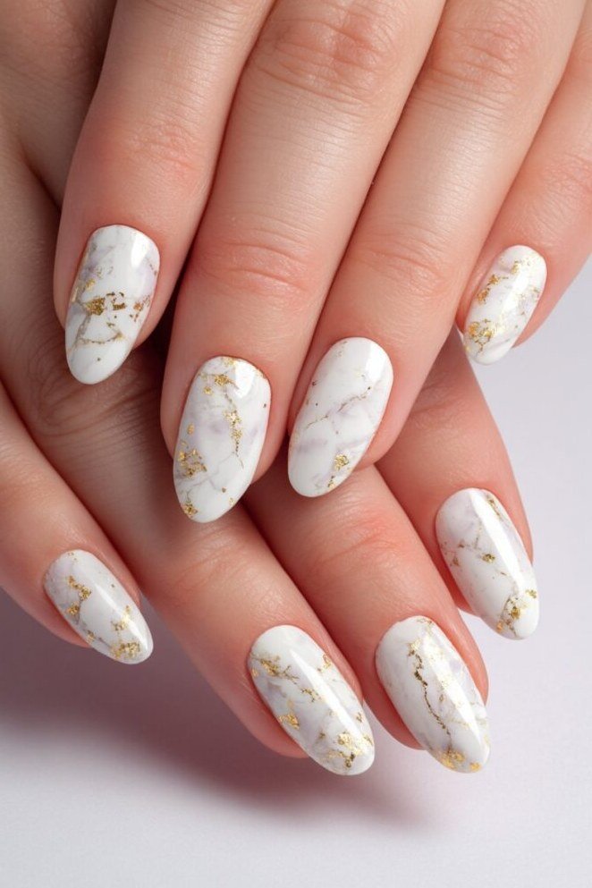 Delicate White Marble on Short Oval Nails - marble nail design for women over 60