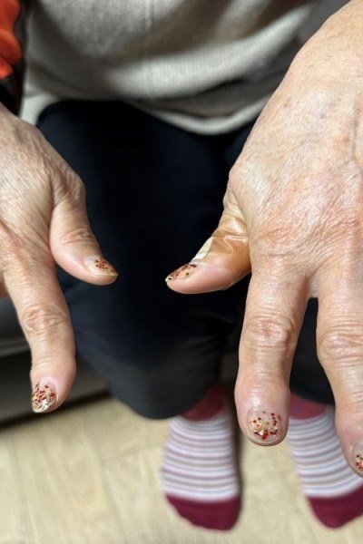 Hands with decorated tips on sheer nude for women over 60 - simple clear nail idea 25