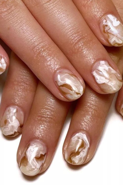 Soft White and Gold Marble Almond Nails - marble nail design for women over 60