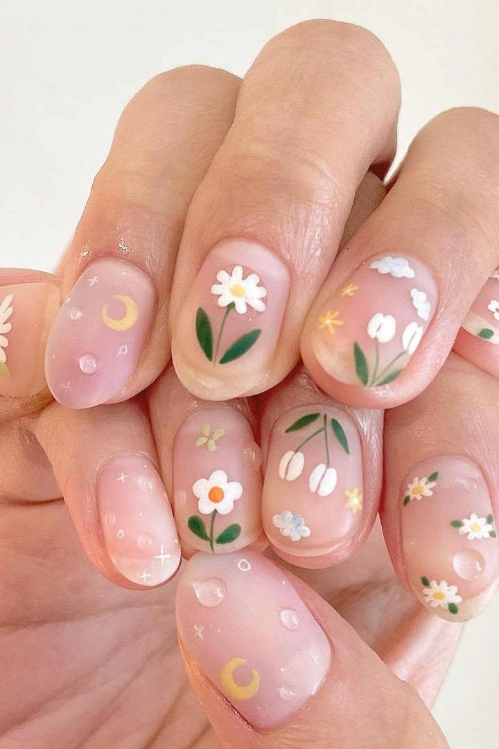 Young hand, daisy flower cluster decals on clear base for women over 60 - simple clear nail idea 34