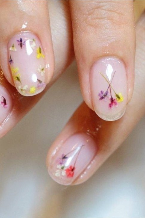 Young hands, colorful wildflower decals on clear for women over 60 - simple clear nail idea 35