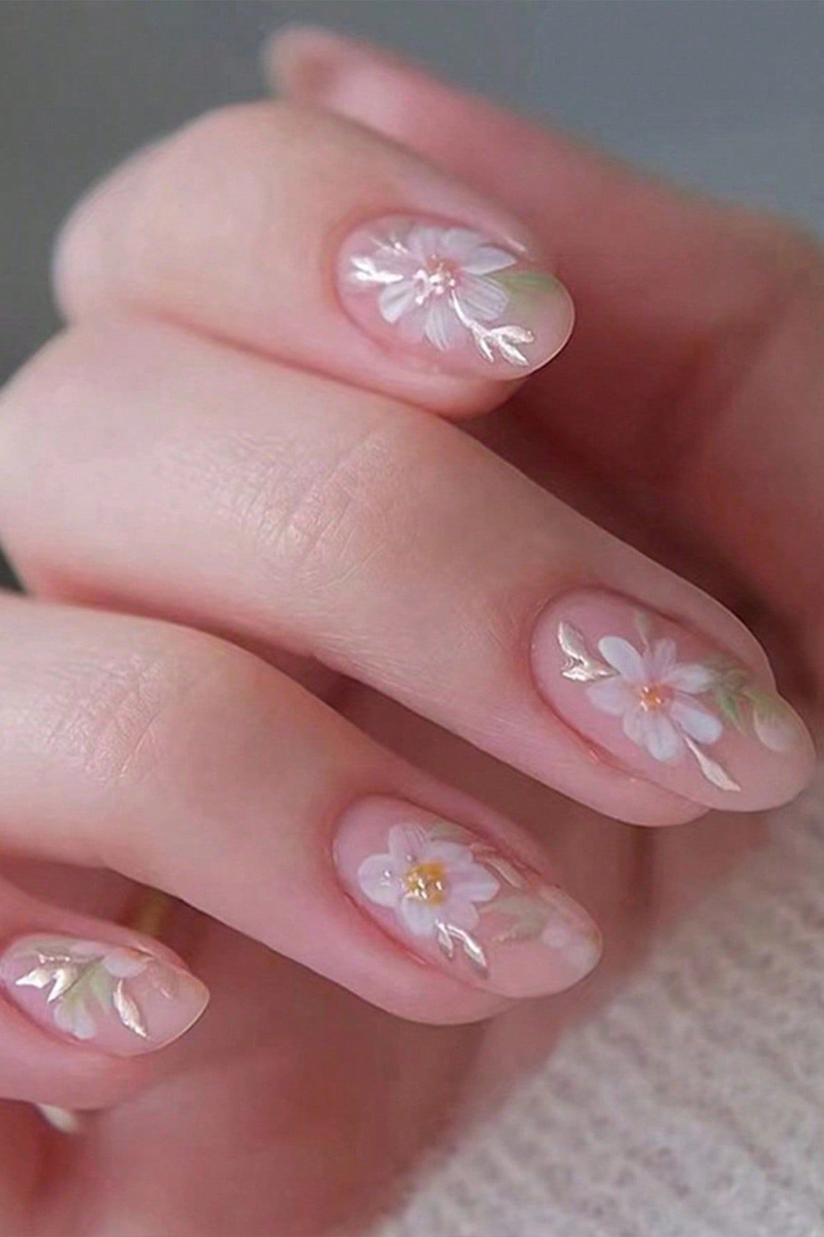 Young hand, white flower decals on clear base for women over 60 - simple clear nail idea 37