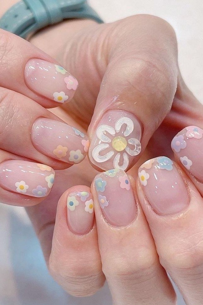 Young hand, big white daisy on sheer pink for women over 60 - simple clear nail idea 38