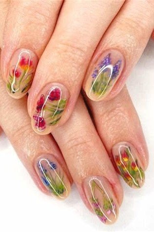 Hands, colorful 3D flowers encapsulated in clear for women over 60 - simple clear nail idea 40