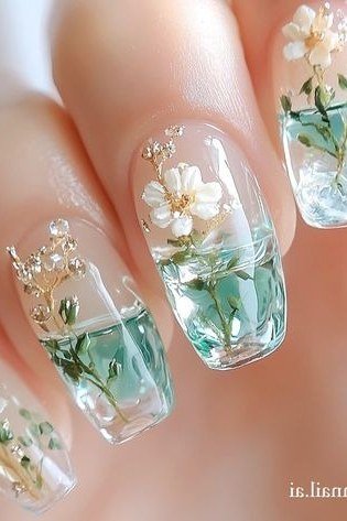 Young hand, pressed white flowers encapsulated in glass-clear long nails for women over 60 - simple clear nail idea 43