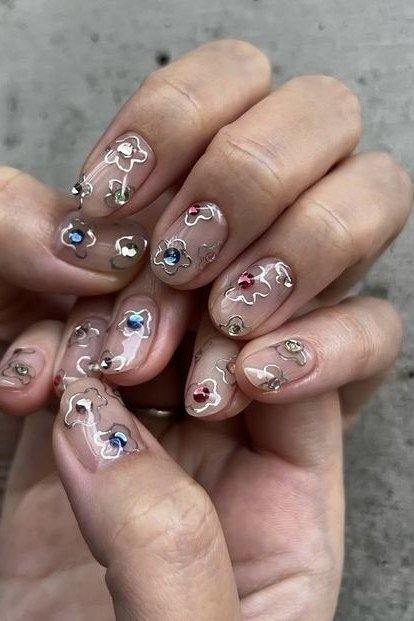 Mature hands, tiny rhinestones on clear base for women over 60 - simple clear nail idea 44