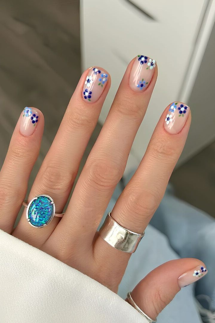 Young hand with rings, tiny dot accents on clear for women over 60 - simple clear nail idea 45