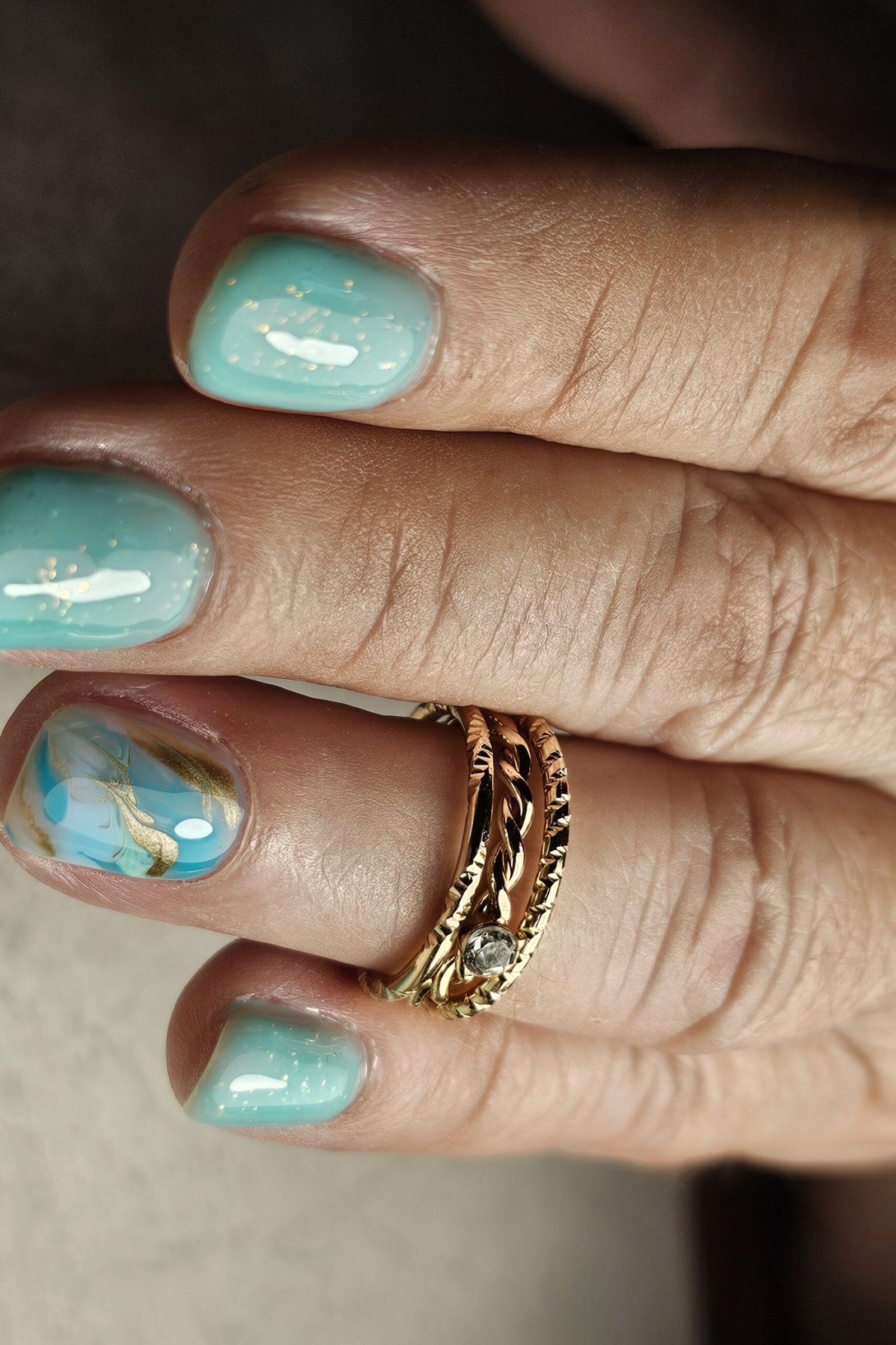 Teal Nails with Marble Accents - marble nail design for women over 60