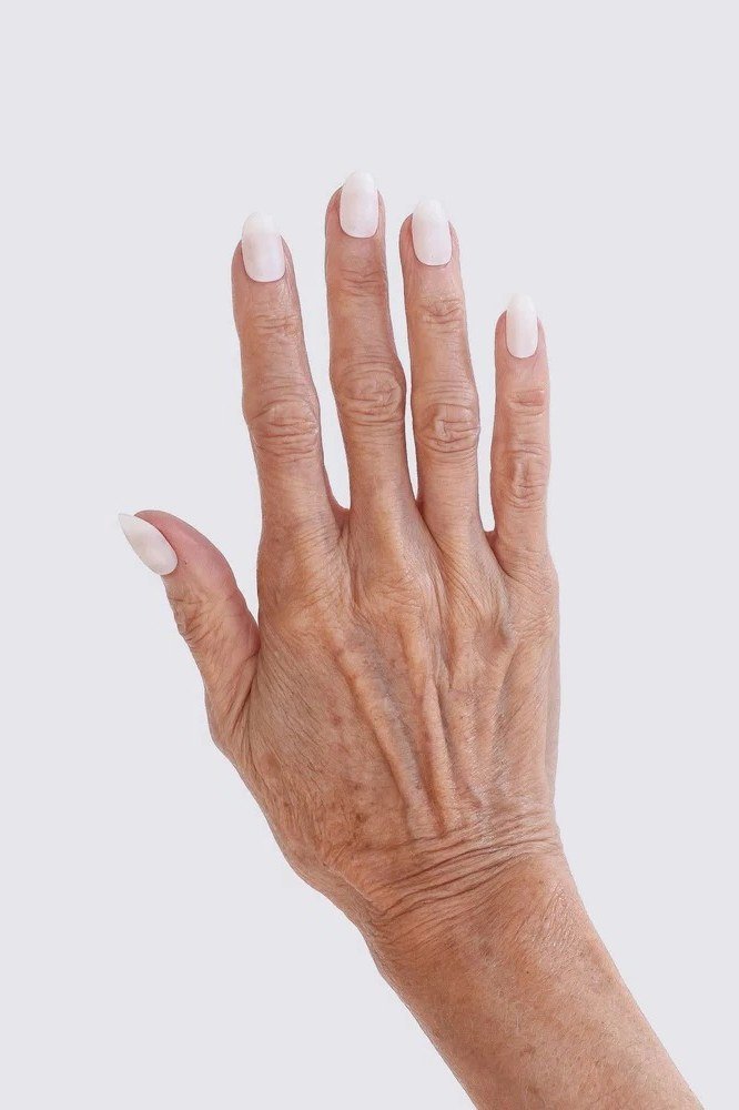 Aged hand, white tips on sheer base for women over 60 - simple clear nail idea 47