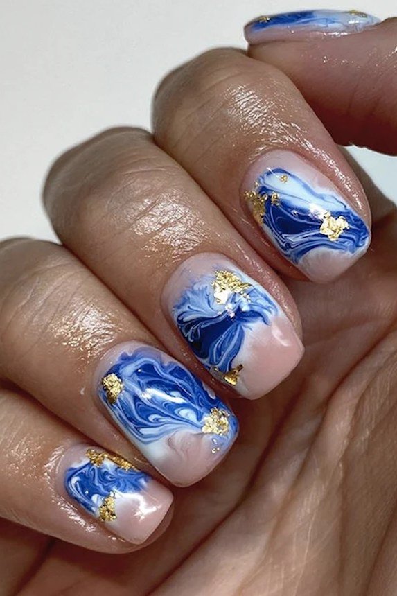 Blue, White, and Gold Water Marble - marble nail design for women over 60