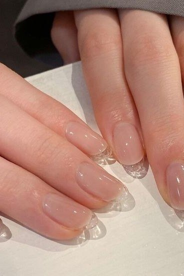 Hands, glass-clear tips on sheer base for women over 60 - simple clear nail idea 60