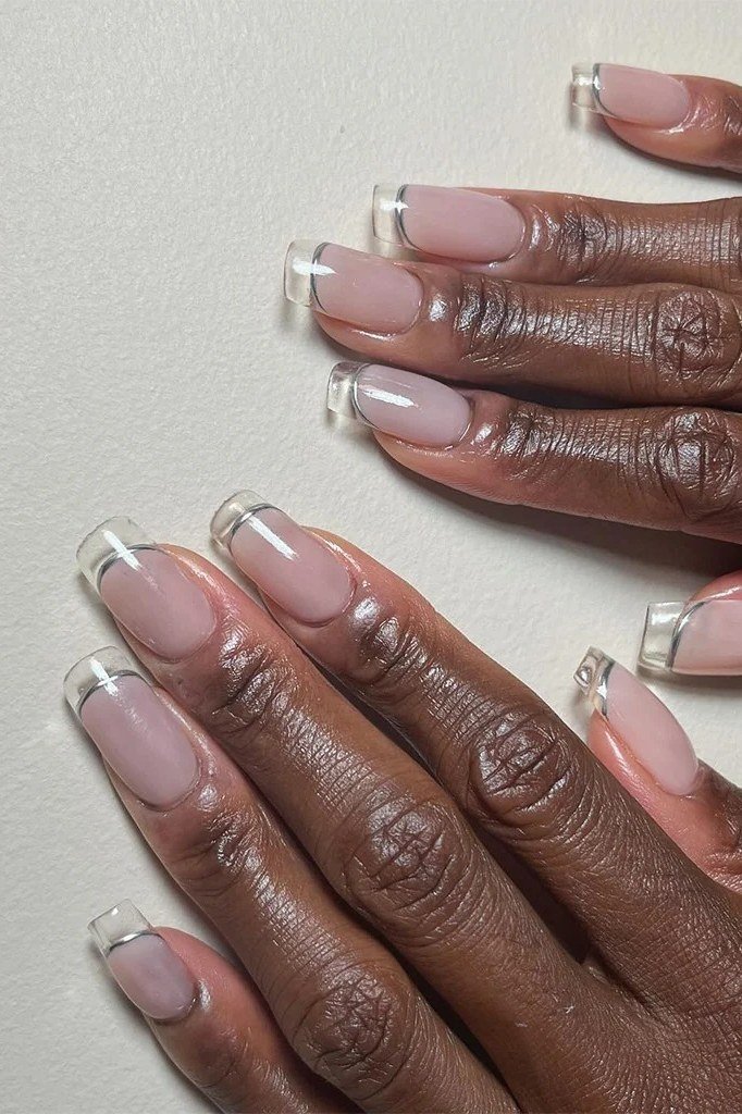 Dark-skinned hands, clear polish with silver tips for women over 60 - simple clear nail idea 62