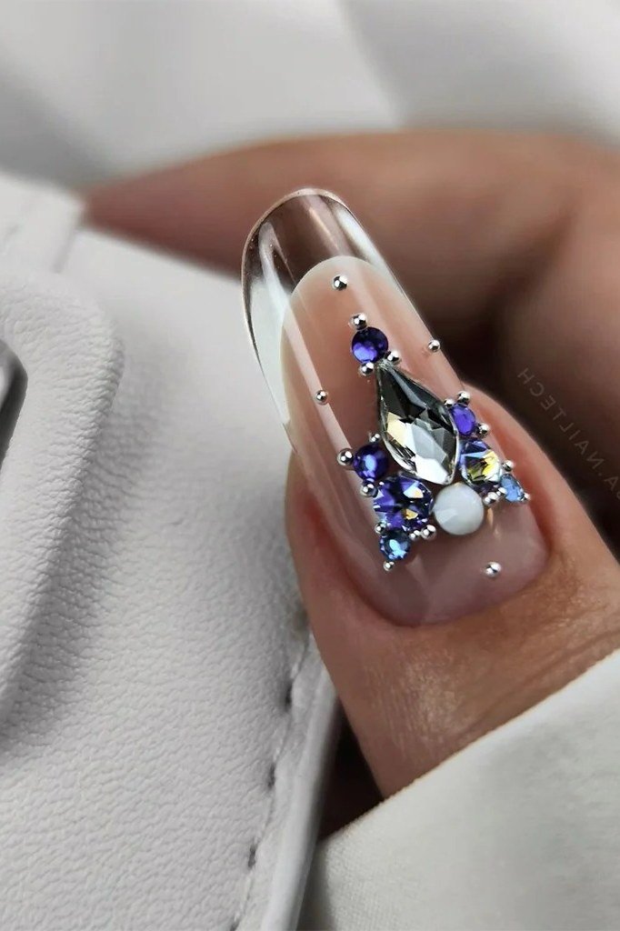 Single nail closeup, blue crystal on clear base for women over 60 - simple clear nail idea 64