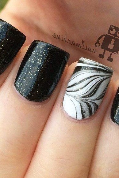 Black Glitter with White Water Marble Accent - marble nail design for women over 60