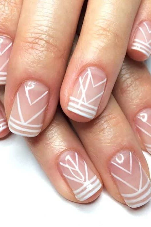 Hands, white geometric line design on clear base for women over 60 - simple clear nail idea 68