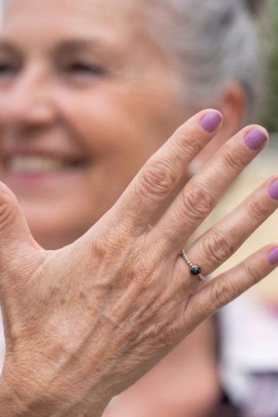 Light mauve cream nails on smiling older woman