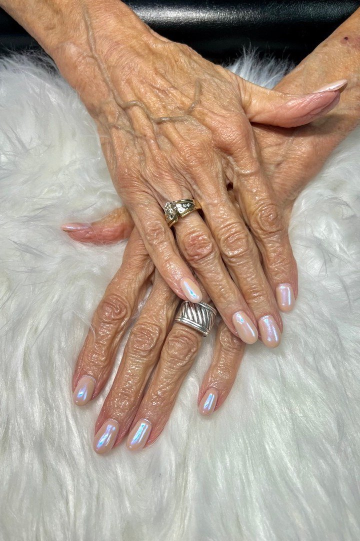 Champagne shimmer nails on very aged hands