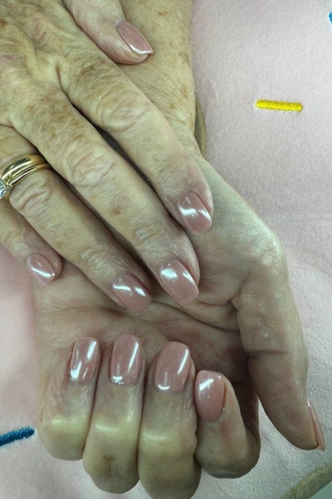 Chrome shimmer nails on very aged hands