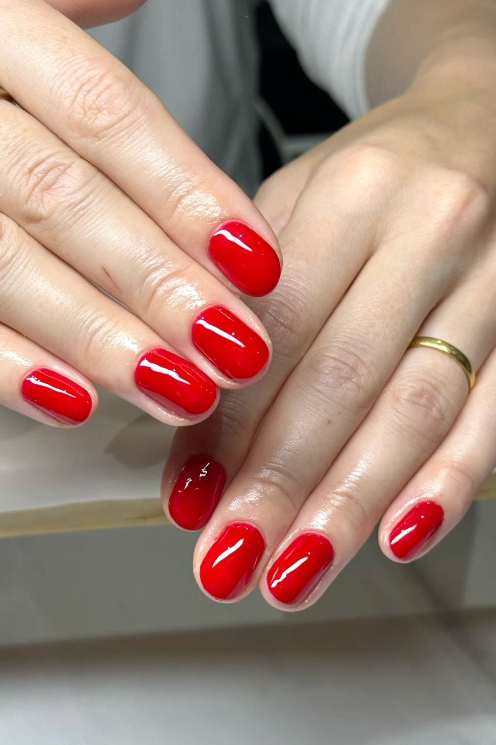 Flawless bright red oval salon manicure for women over 60